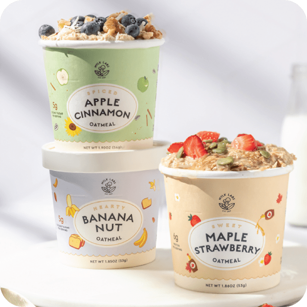 three instant oatmeal cups with fruit toppings